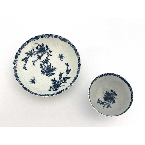 802 - A Worcester blue and white tea bowl and saucer, workmans marks, circa 1757, in the Feather Mould Flo... 