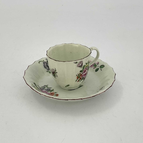 806 - A Worcester polychrome fluted coffee cup and saucer, circa 1770, painted with floral sprigs and bouq... 