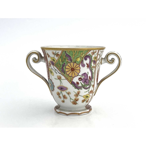 809 - A Spode 287 pattern twin handled cup, circa 1810, footed form, painted with Japanese Kakiemon style ... 