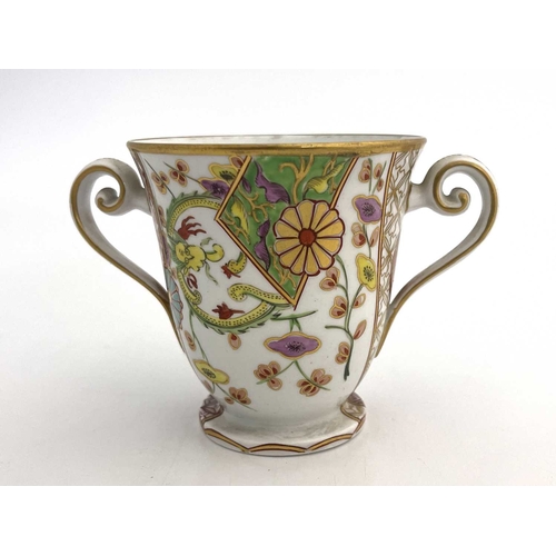 809 - A Spode 287 pattern twin handled cup, circa 1810, footed form, painted with Japanese Kakiemon style ... 