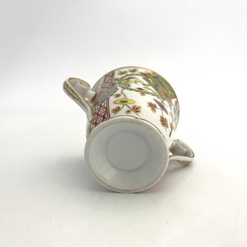 809 - A Spode 287 pattern twin handled cup, circa 1810, footed form, painted with Japanese Kakiemon style ... 