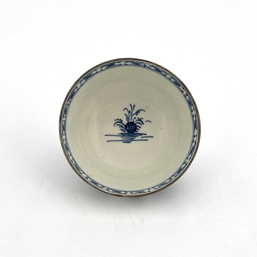 818 - A Lowestoft blue and white tea bowl, circa 1770, painted with a Chinese landscape of pagodas and isl... 