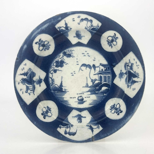 819 - A Bow powder blue plate, circa 1760, decorated with Oriental landscape panels and floral sprigs, pse... 