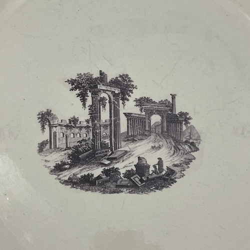 837 - A large English creamware charger, 18th century, decorated with an image of Palmyra. 39 cm diameter.