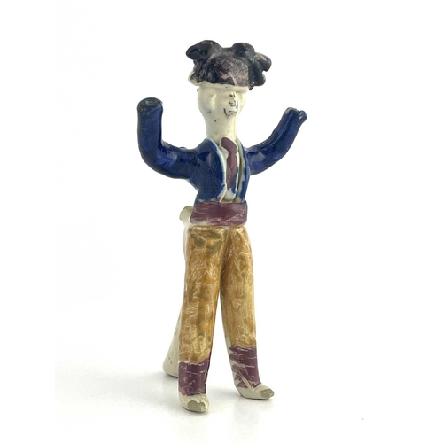 838 - A Staffordshire pottery figural whistle, 19th century, modelled as a man with arms raised, polychrom... 