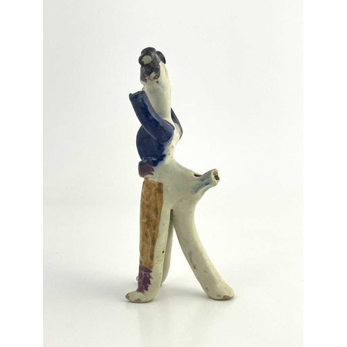 838 - A Staffordshire pottery figural whistle, 19th century, modelled as a man with arms raised, polychrom... 