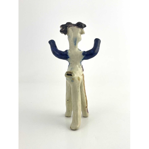 838 - A Staffordshire pottery figural whistle, 19th century, modelled as a man with arms raised, polychrom... 