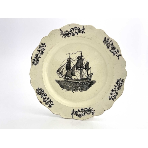 843 - A Liverpool Herculaneum creamware ship plate, with shaped rim, printed in black with a view of a thr... 