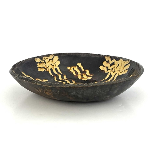 855 - An English slipware dish, circa 1780, circular form with pie-crust rim, 33cm diameter