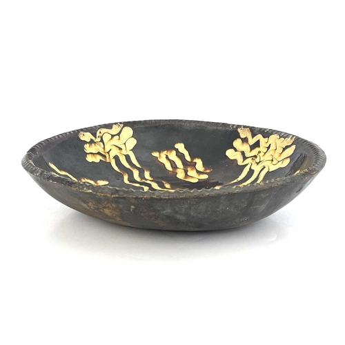 855 - An English slipware dish, circa 1780, circular form with pie-crust rim, 33cm diameter