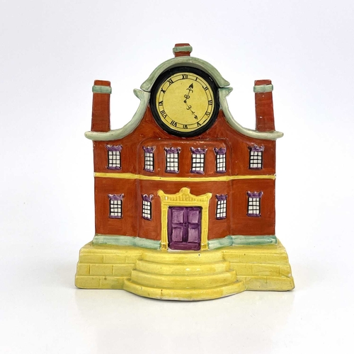 863 - A Staffordshire pottery pastille burner, in the form of a mansion with clock dial, circa 1820, 17cm ... 