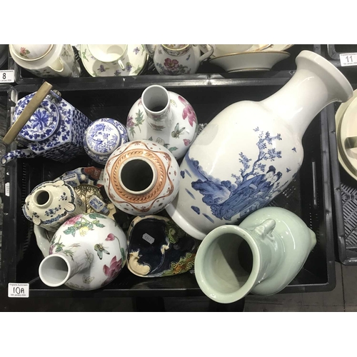 10A - A collection of Chinese porcelain, including a blue and white vase, teapot with brass handle, pair o... 