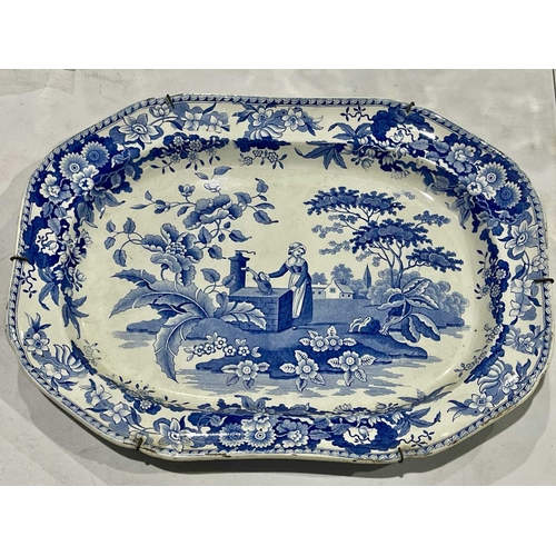 46 - An early 19th century blue and white meat plate, The Font, octagonal form, decorated with a lady by ... 