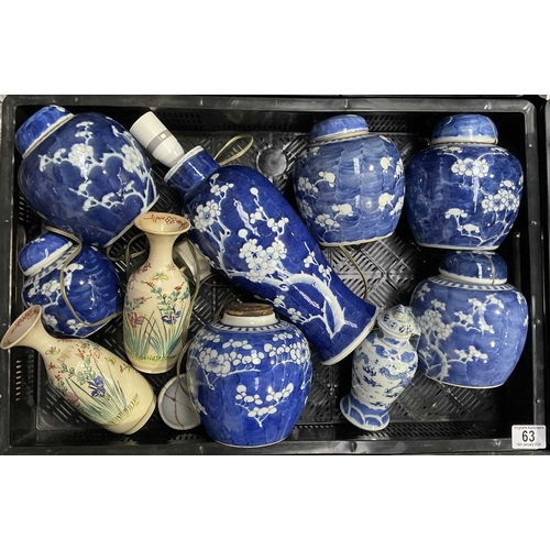 63 - A collection of Chinese blue and white ginger jars, each decorated with flowering prunus branches, c... 