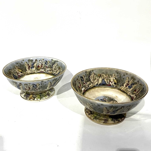 70 - Two Prattware punch bowls, circular form, printed with Bacchanalian scenes, 34cm diameter (2)
