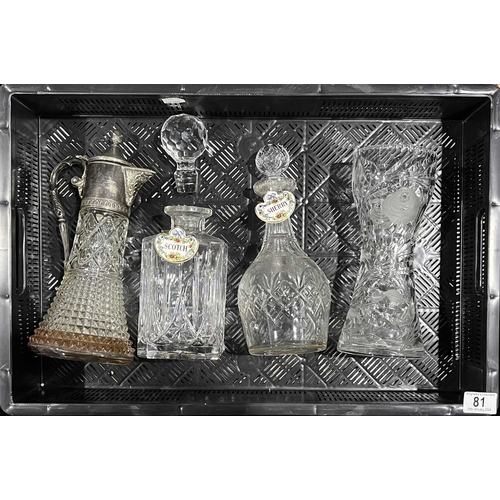 81 - Two cut glass decanters and stoppers, with enamel scotch and sherry labels, together with a metal mo... 