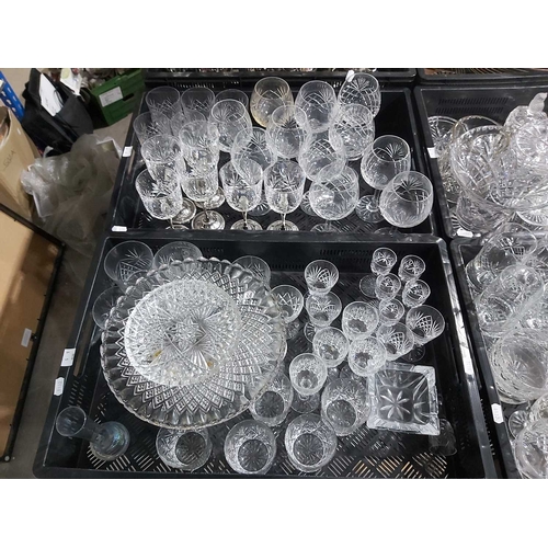 106 - A large collection of cut glass, including sherry and wine sets, tumblers, tankards etc (6 trays)