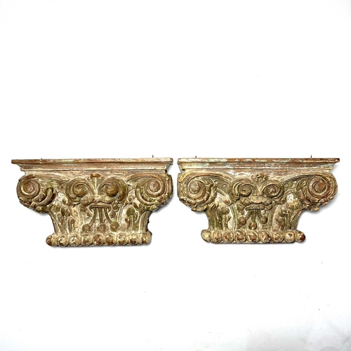 119 - A pair of carved wooden capitals, in the Corinthian style carved foliate scroll and floral decoratio... 