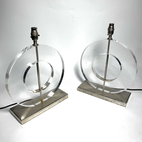 120 - A pair of mid century style lucite and chromed metal table lamps, circa 1970/1980, disc form with op... 