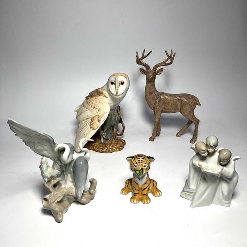 125 - George McMonigle for Franklin Mint, a model of a barn owl, together with two Nao porcelain figure gr... 