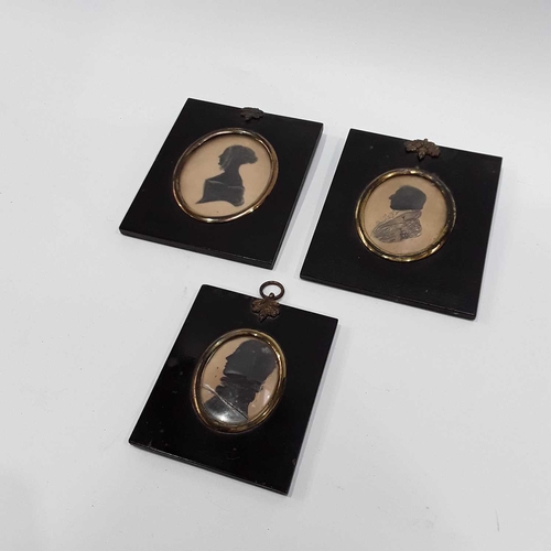 163 - Three 19th Century oval silhouette portrait miniatures, black lacquer frames (3)