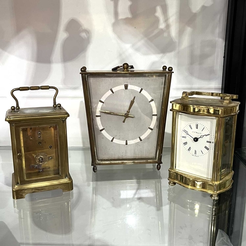 176 - Two traditional brass carriage timepieces, one signed 'J.J. Browne & Sons, the other Saqux .....Lond... 