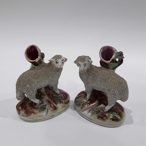 178 - A pair of 19th Century Staffordshire sheep spill vases, shredded clay decoration, 13cm high, and a s... 