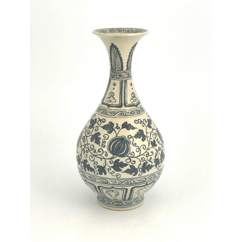 210 - A Chinese blue and white vase, baluster form, painted with pomegranates in foliate scroll ground, be... 