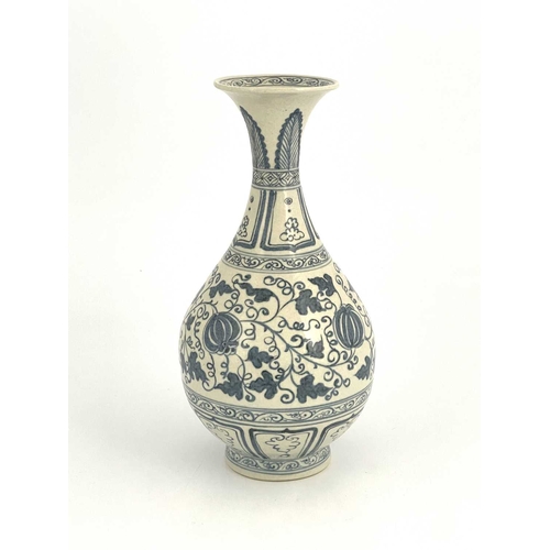 210 - A Chinese blue and white vase, baluster form, painted with pomegranates in foliate scroll ground, be... 