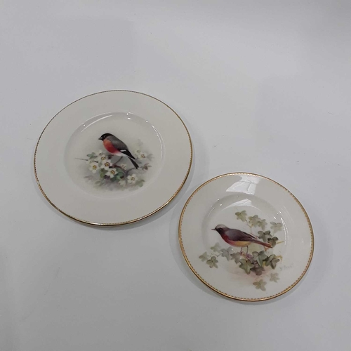 250 - W Powell for Royal Worcester, a painted side plate, circa 1930, decorated with a Bullfinch and apple... 