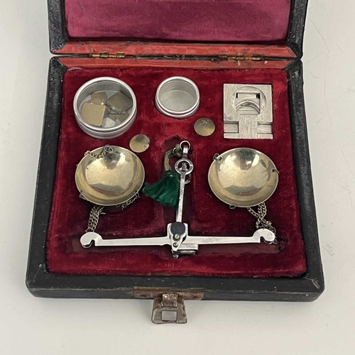 277 - An antique Chinese set of weighing scales, with weights and added accessories in a fitted leather bo... 