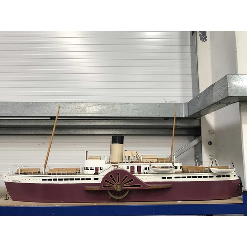 294 - A scratch built model of a paddle steamer, 123cm long