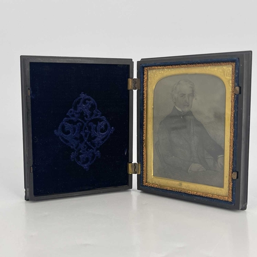 305 - A Union thermoplastic ambrotype case by Samuel Peck & Co, circa 1858, moulded cover scene of Sir Rog... 