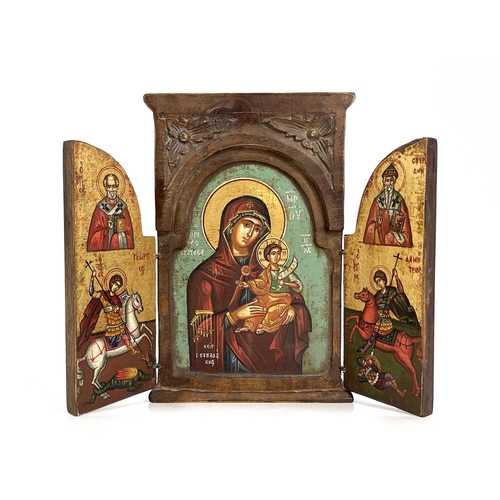 306 - A Greek Orthodox triptych ikon, wooden frame with leaf-carved spandrels to the pediment, hinged doub... 