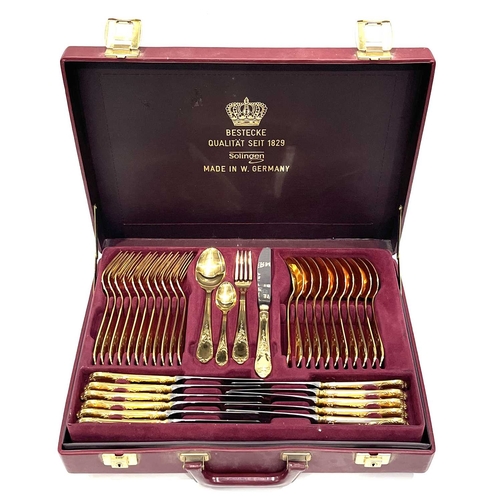 314 - An SBS Bestecke Solingen 23-24 carats gold-plated cutlery set