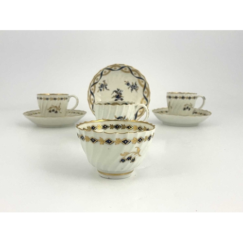 322 - A collection of Worcester Flight tea ware, circa 1780, wrythen fluted underglaze blue and gilt sprig... 