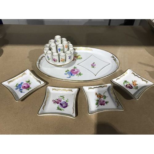 327 - A Dresden porcelain smoking set, early 20th Century, incorporating an integral multi-cigarette holde... 