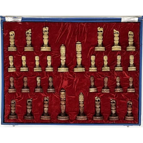 338 - An Indian carved soapstone chess set, in a velveteen lined box