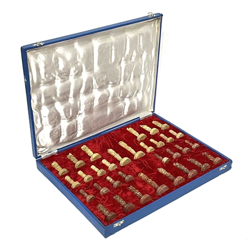 338 - An Indian carved soapstone chess set, in a velveteen lined box