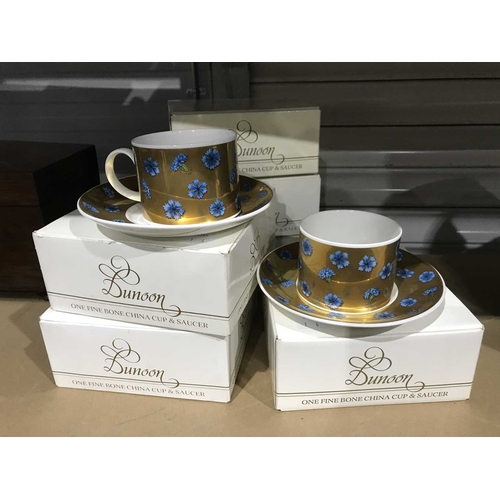 341 - Dunoon Ceramics, a set of six English Fine Bone China coffee cans and saucers, decorated in blue on ... 