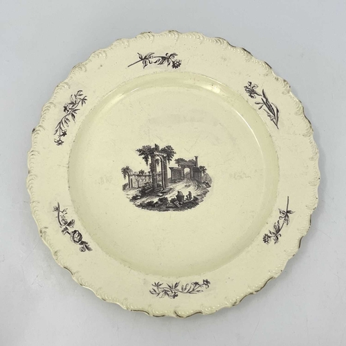 344 - A large English creamware charger, 18th century, decorated with an image of Palmyra. 39 cm diameter.