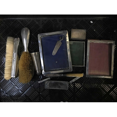 354 - A collection of silver, including picture frames, silver backed dressing table brush, a pepper in th... 