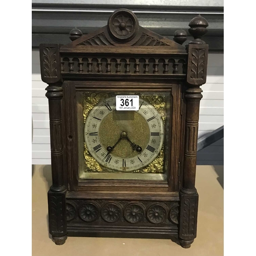 361 - A German carved oak Aesthetic Movement mantel clock