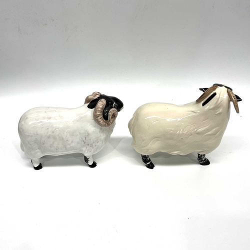 427 - David Sharp for Bayer, a coin bank in the form of a horned sheep, 19cm high, together with a similar... 