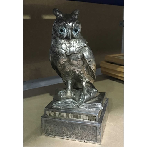 429 - Masonic interest, a presentation trophy in the form of an owl perched upon an open book, mounted ins... 