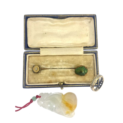 502A - Two stickpins, a ring and a jade pendant