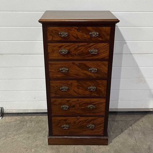 663 - A late Victorian mahogany Wellington chest, circa 1890, moulded top over six short flame mahogany gr... 