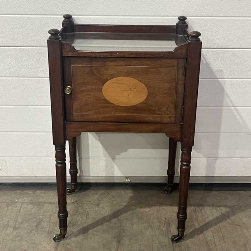 665 - A bedside cabinet, featuring a glass top and parquetry inlaid single door, on turned supports and ca... 