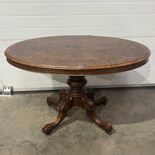 668 - A mid-Victorian oval marquetry inlaid burr walnut tilt-top centre table, circa 1860, on four cabriol... 