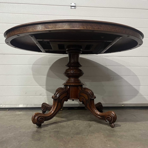 668 - A mid-Victorian oval marquetry inlaid burr walnut tilt-top centre table, circa 1860, on four cabriol... 